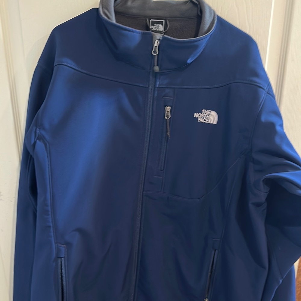 The North Face Blue Performance Jacket with Stand-Up Collar